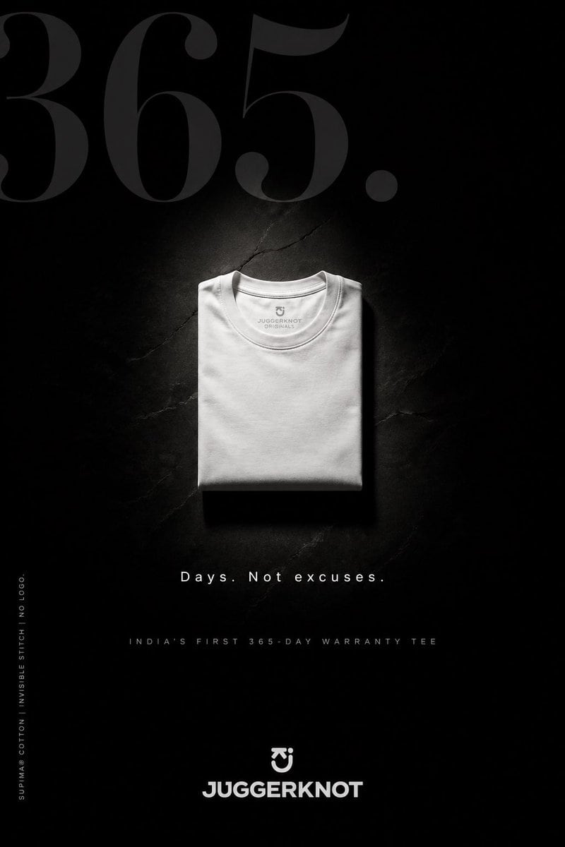 Create a premium minimalist fashion advertisement poster in a tall vertical format for a folded crew-neck t-shirt brand. Use a deep matte black background with a subtle cracked stone or c...