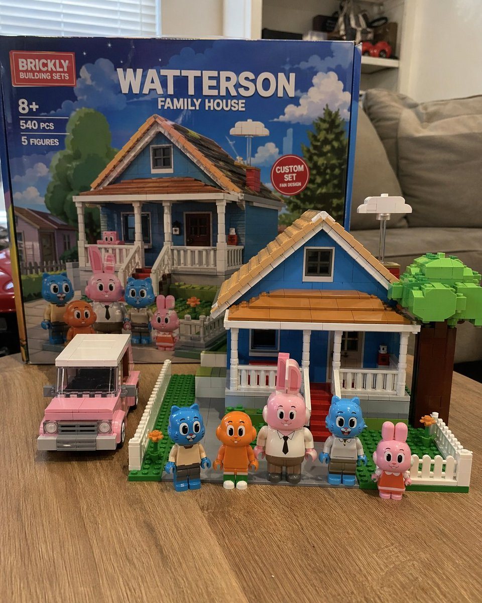 Generates a photorealistic image of a custom toy building set with its box, assembled house, vehicle, and minifigures on a table.