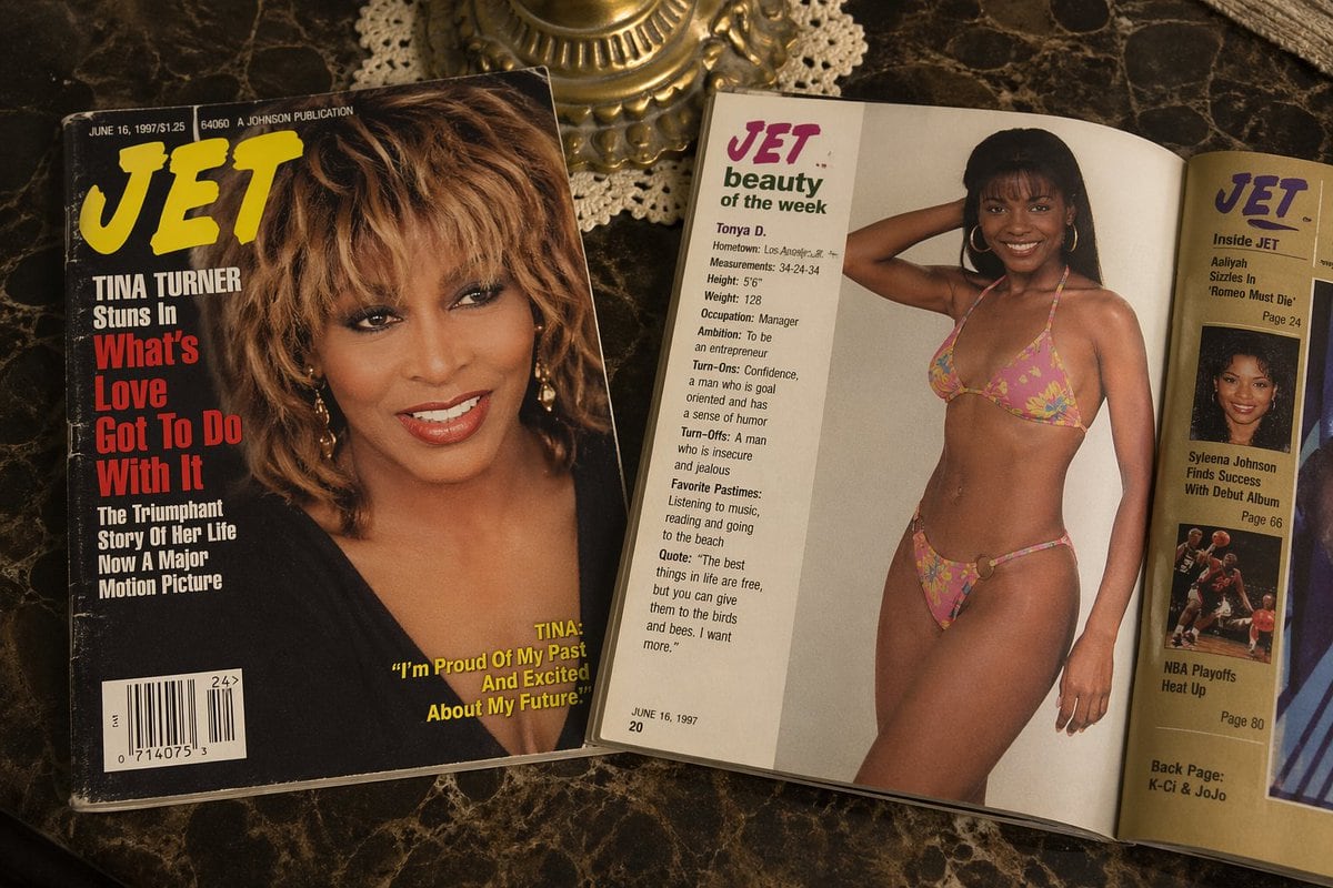 Late 90s Jet magazine with cover promoting What’s Love Got To Do With It. on a coffee table next to an open jet magazine which is opened to the JET Beauty of the week page