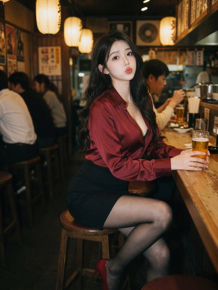 A photorealistic portrait of a young East Asian woman sitting at a wooden counter in a dimly lit izakaya. She has long wavy black hair and wears a deep red silk button-down shirt, a black...