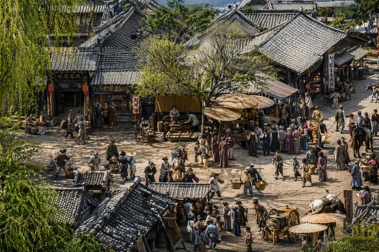 A highly detailed, hyper-realistic cinematic 3D render of an ancient Chinese street scene inspired by Along the River During the Qingming Festival. The elevated, wide-angle perspective lo...